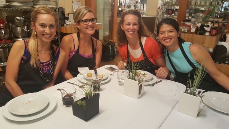 Team seated at the table during a cooking class