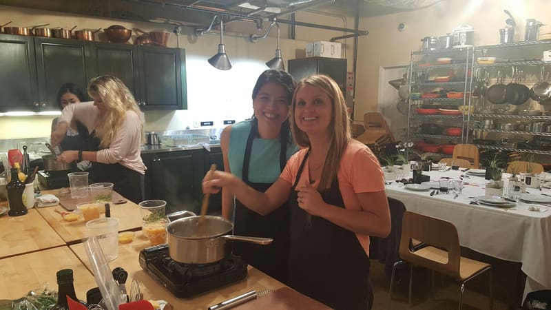 Team cooking together at the stove