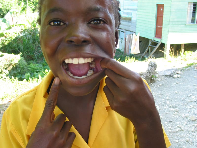 Smiling child proudly showing their teeth